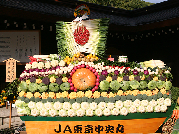 -Many sake barrels and Western wine barrels are displayed as offerings to the shrine.